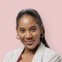 Happy woman in a blazer with her arms crossed female-customer
